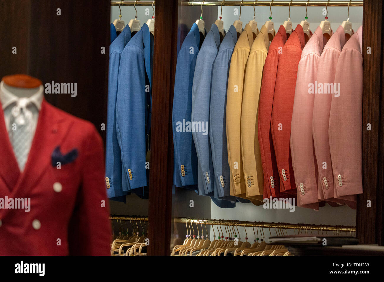 Different colors formal man dress suits inside italian shop detail ...