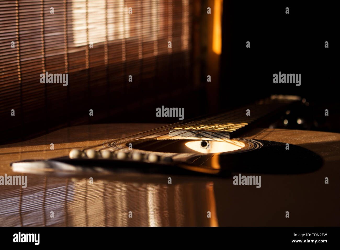Acoustic Guitar In Music Studio Close up. Shined By The Sun At The