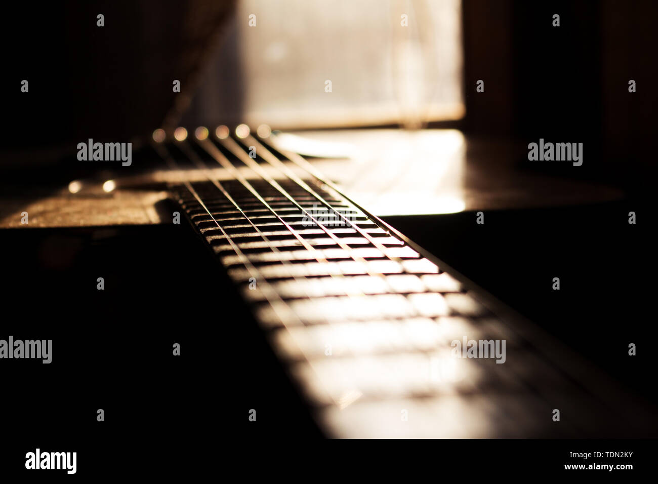 Acoustic Guitar In Music Studio Close up. Shined By The Sun At The