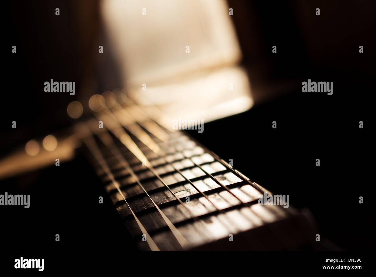 Acoustic Guitar In Music Studio Close up. Shined By The Sun At The