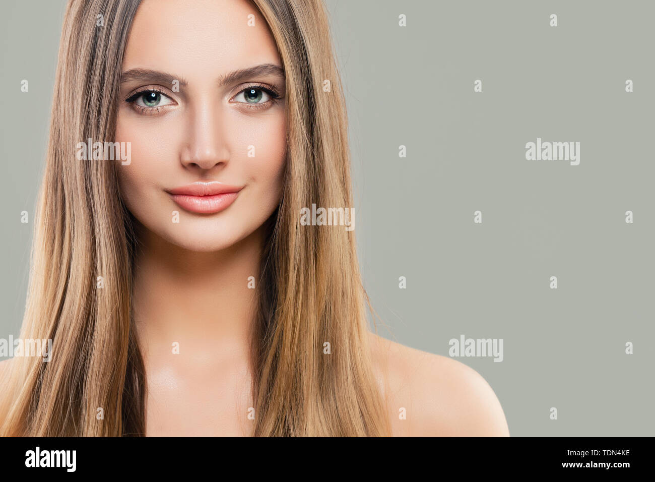 Young Perfect Woman With Clear Skin And Long Straight Hair
