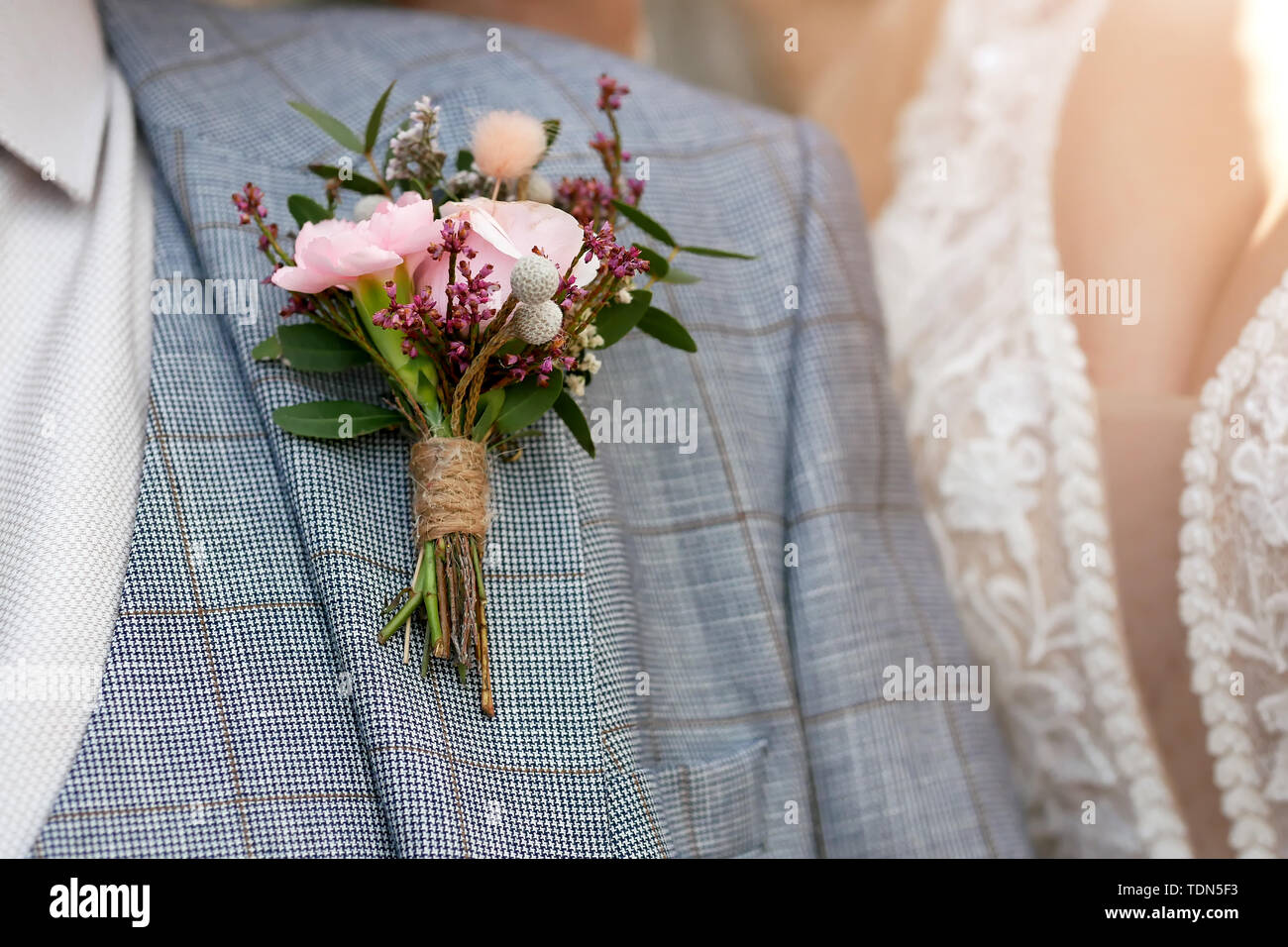 wedding background, boutonniere on the grooms jacket Stock Photo