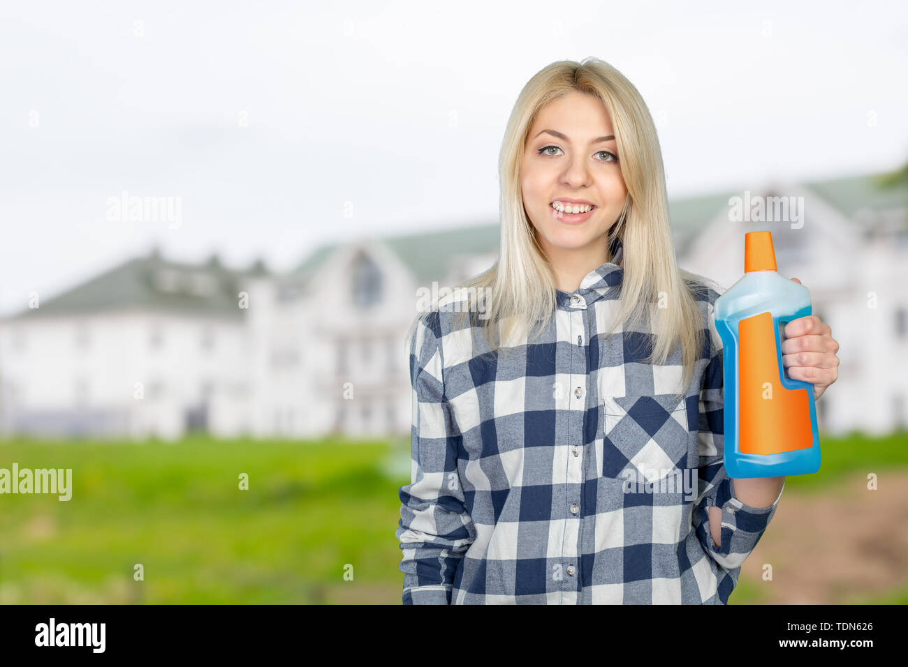 Portrait of a woman with cleaning liquid Stock Photo