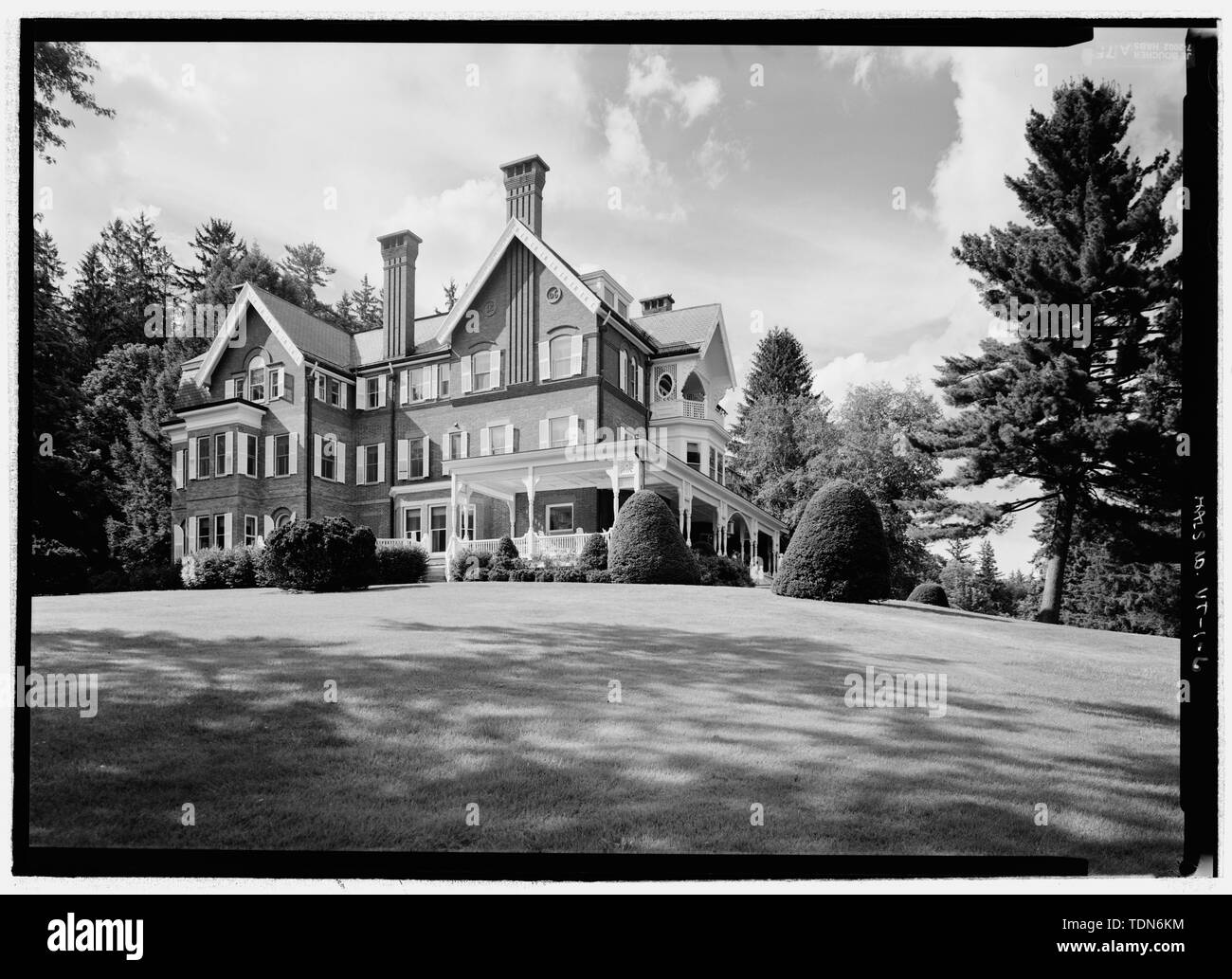 Perspective view of the south facade of the mansion and the south lawn, from the southeast. (more distant view). The view includes manicured hemlock (Tsuga canadensis), an annual flower bed, white pine (Pinus strobus) and white birch (Betula species). - Marsh-Billings-Rockefeller National Historical Park, 54 Elm Street, Woodstock, Windsor County, VT; Marsh, George Perkins; Billings, Frederick; Rockefeller, Mary French; Rockefeller, Laurence S; Dolinsky, Paul D, project manager; Price, Virginia  Barrett, transmitter; Boucher, Jack E, photographer; Mason, Anne, transmitter; Dilworth, Douglas, la Stock Photo