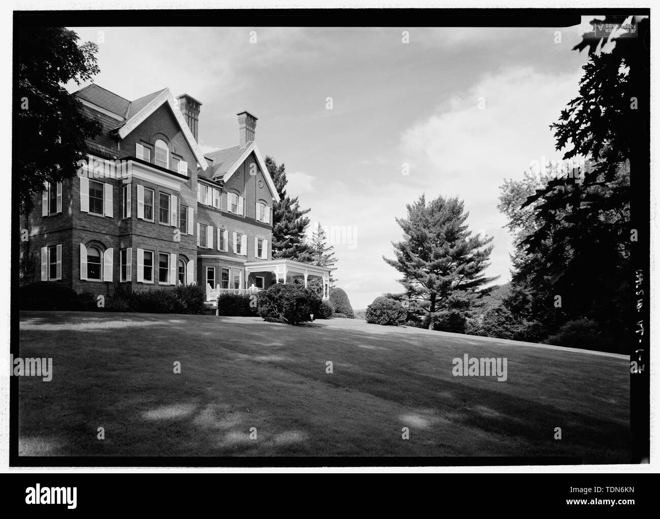 Perspective view of the south facade of the mansion and the south lawn, from the southwest. The view includes foundation and lawn plantings of wingbark euonymus (Euonymus fortunei vegetis), Japanese yew (Taxus cuspidata nana), manicured hemlock (Tsuga canadensis), and white pine (Pinus strobus). - Marsh-Billings-Rockefeller National Historical Park, 54 Elm Street, Woodstock, Windsor County, VT; Marsh, George Perkins; Billings, Frederick; Rockefeller, Mary French; Rockefeller, Laurence S; Dolinsky, Paul D, project manager; Price, Virginia  Barrett, transmitter; Boucher, Jack E, photographer; Ma Stock Photo
