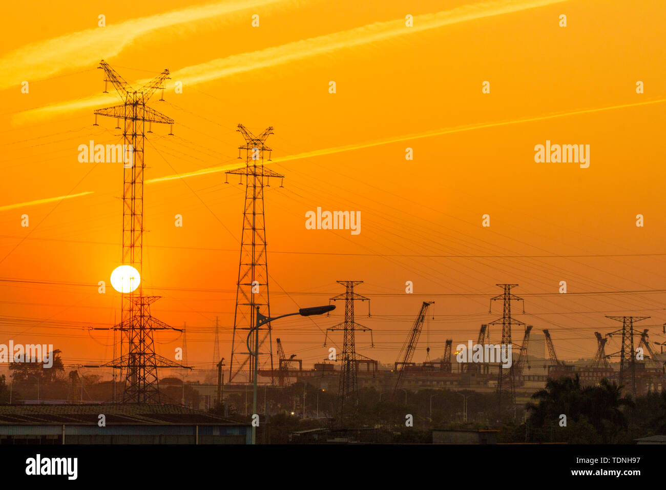 A transmission tower in the sunset Stock Photo - Alamy