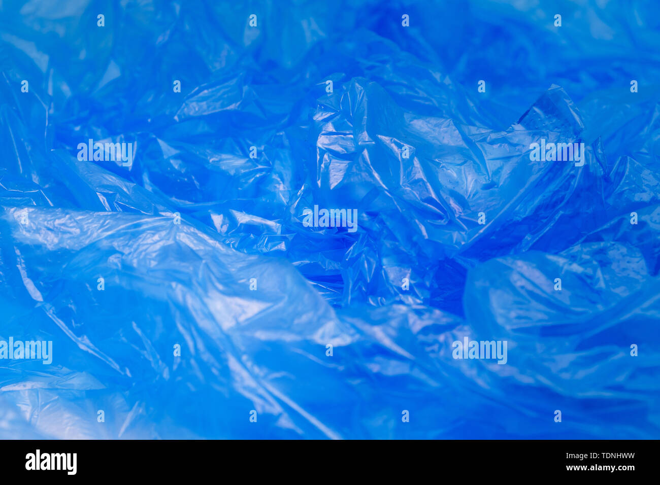 Blue Plastic Bag Texture. Abstract Wrinkled Background of Plastic Garbage Stock Photo