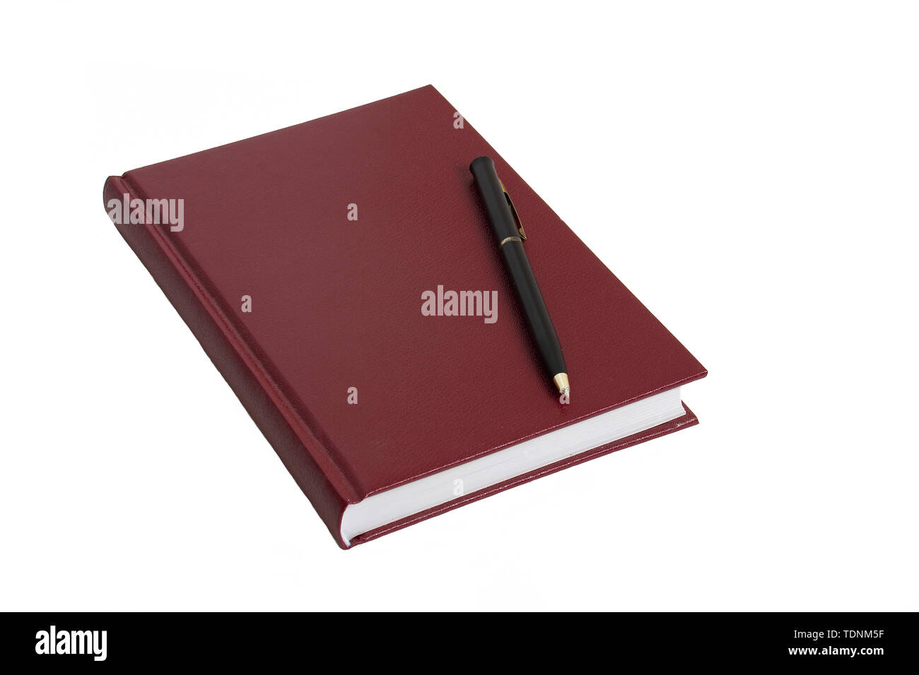 The burgundy notebook and black pen lie on a white table. Task ...