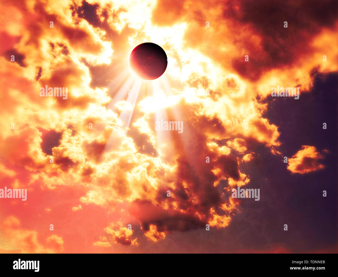 Solar eclipse, moon facing the sun. Sun rays passing through the clouds. God's Rays. It occurs when the shadow cast by the Moon blocks the Sun Stock Photo