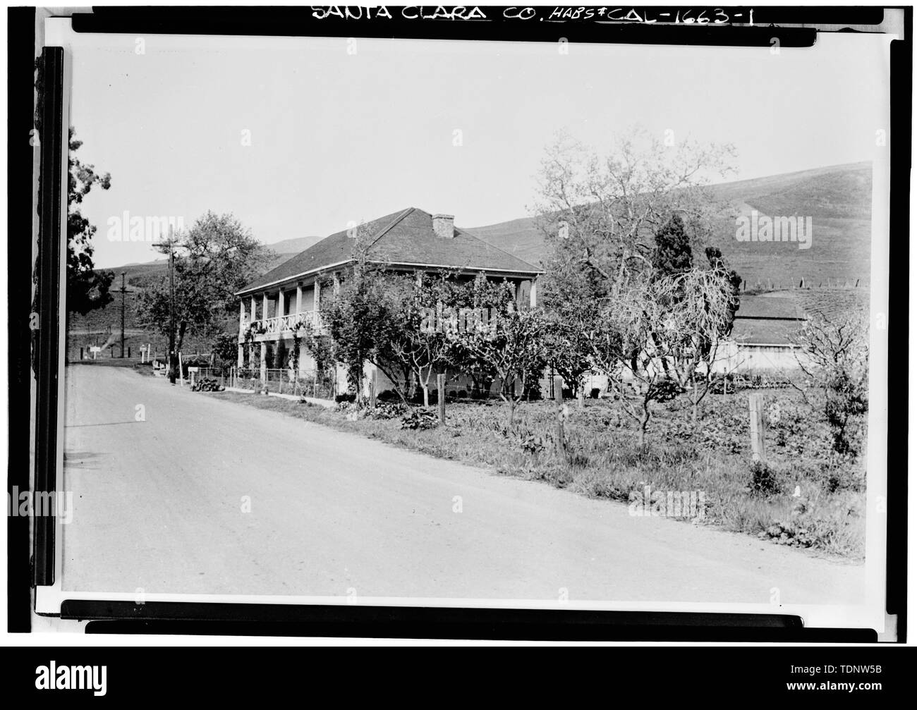 Photocopy of February 1940 photograph by Willis Foster, rephotographed August 1940. DISTANT VIEW OF FRONT AND SIDE - Jose Maria Alviso Adobe, Milpitas, Santa Clara County, CA Stock Photo