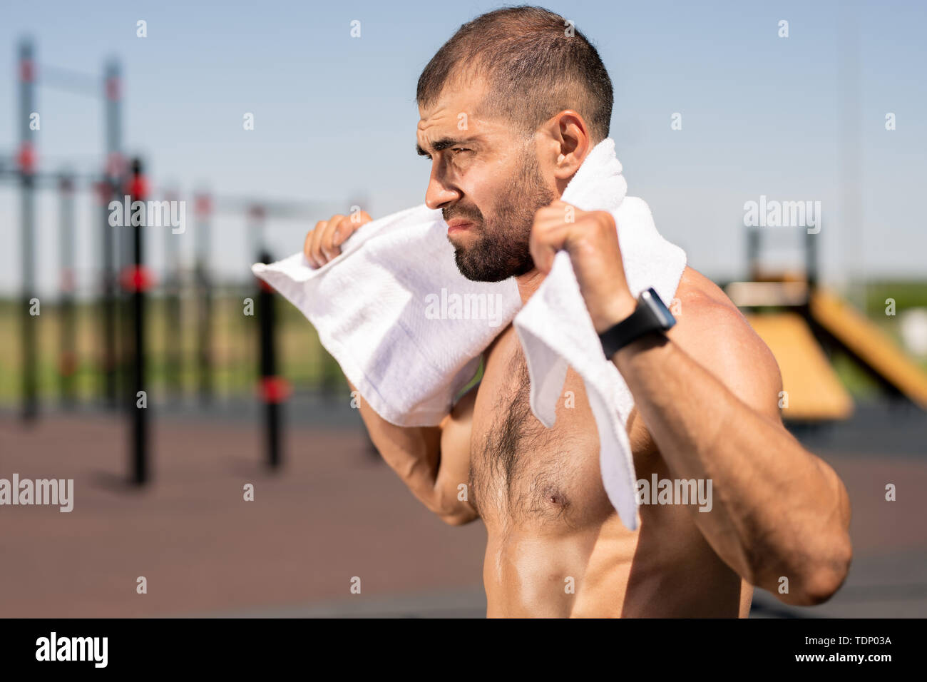 Young topless muscular man with white soft towel on his neck having break on sportsground after hard training Stock Photo - Alamy Young topless muscular man with white soft towel on his neck having break on sportsground after hard training Stock Photo - Alamy