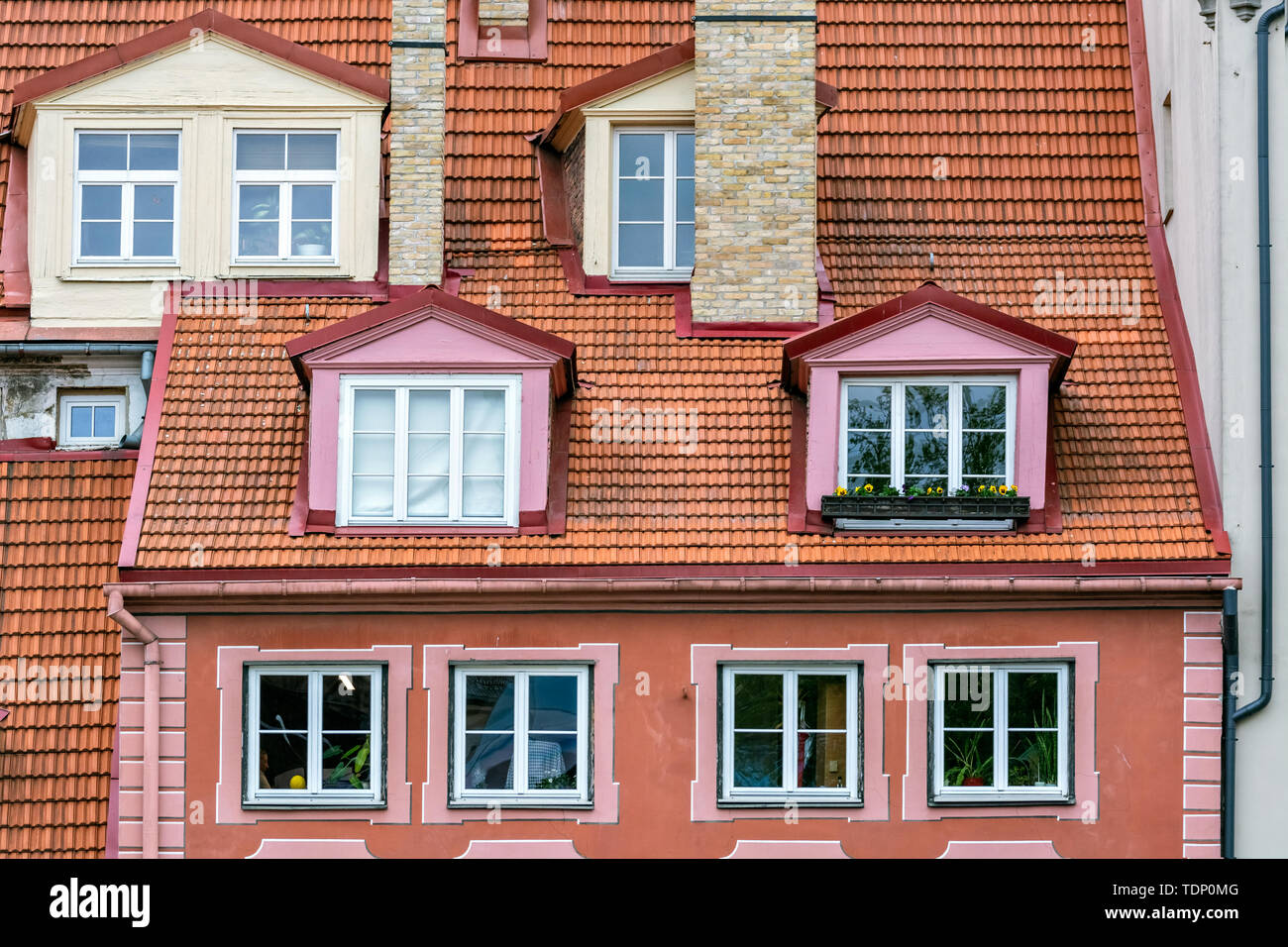 View of the roof of red tiles with attics in the old part of Riga. Stock Photo