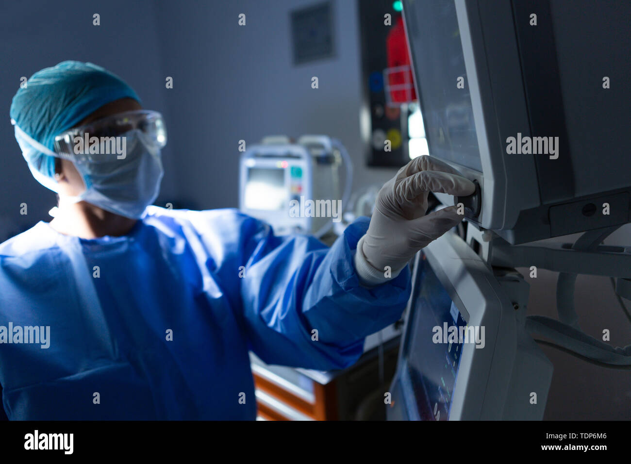 Female surgeon using monitor in operation theater Stock Photo Alamy