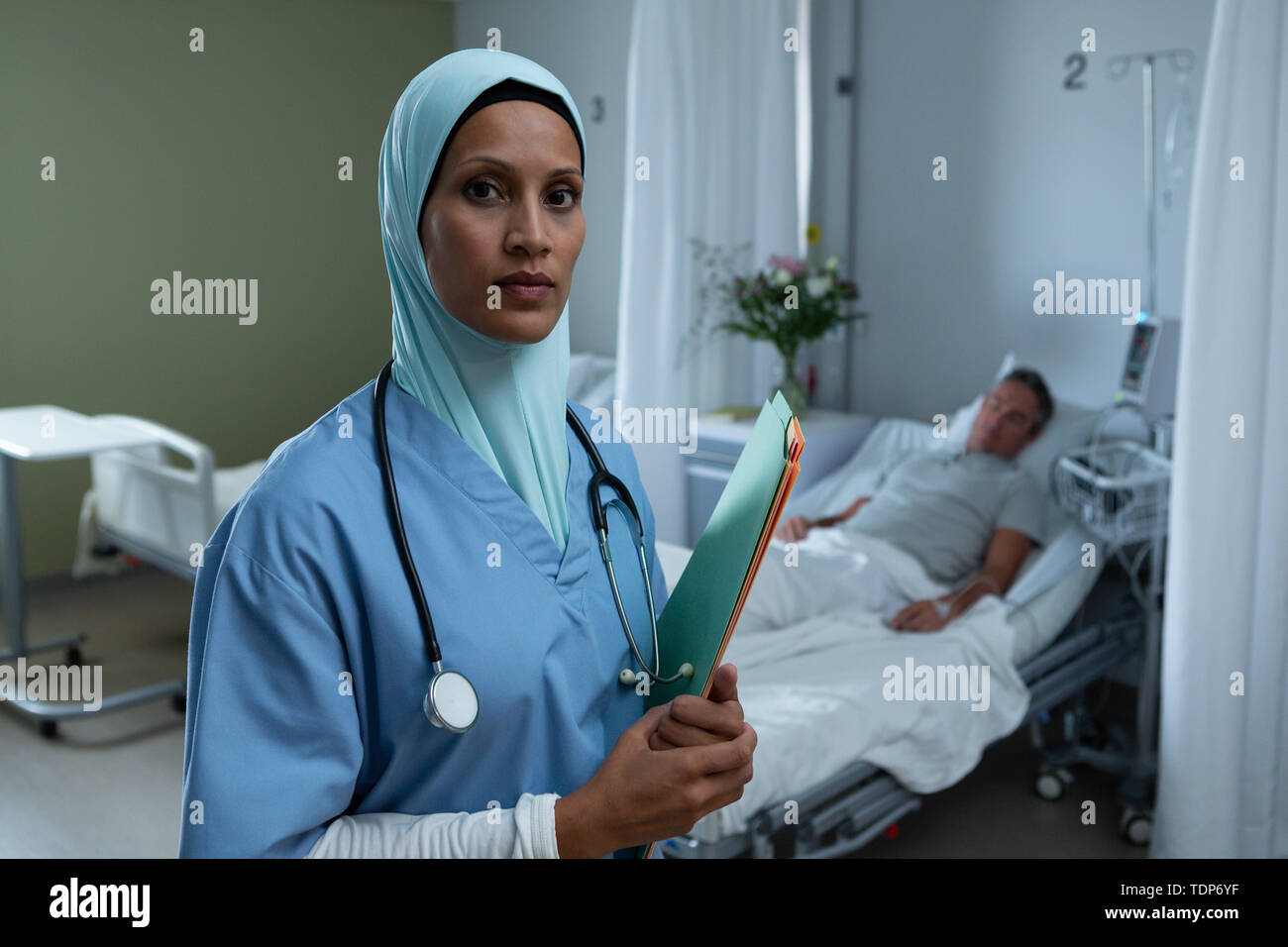 Female doctor in hijab standing with medical report in the hospital Stock Photo Alamy