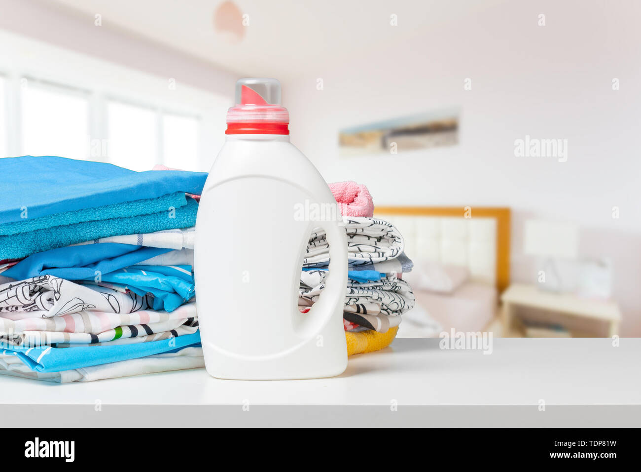 Colorful towels and liquid laundry detergent Stock Photo Alamy