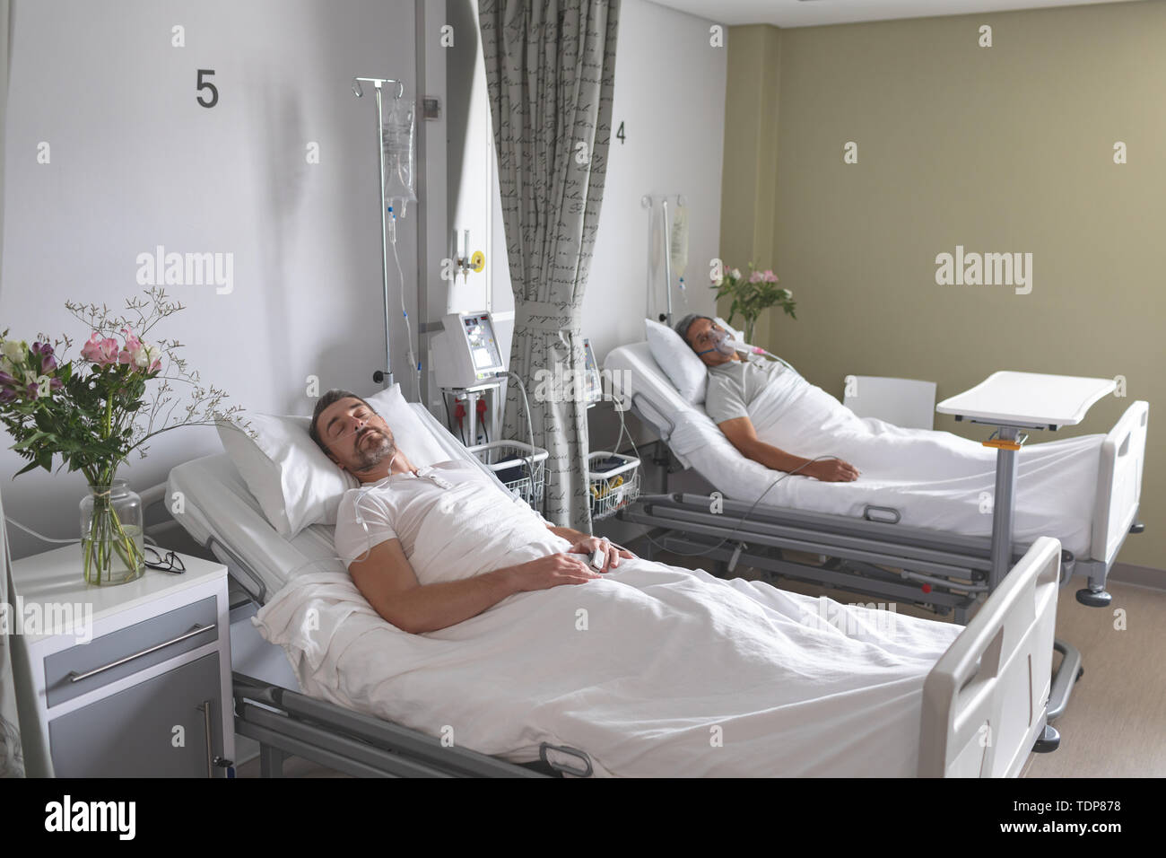 Male patients sleeping in bed in the ward Stock Photo Alamy