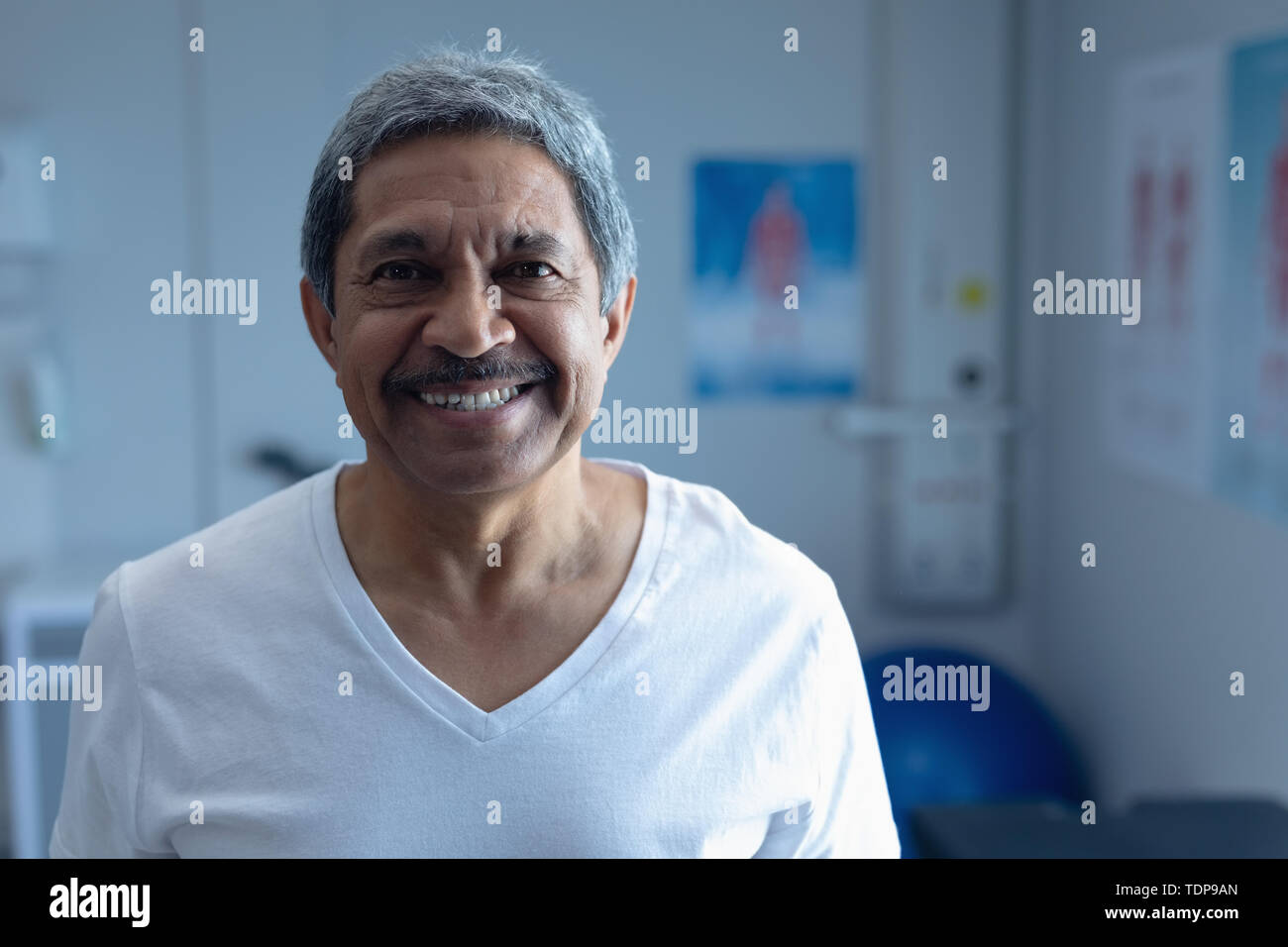 Male patient smiling in the ward at hospital Stock Photo