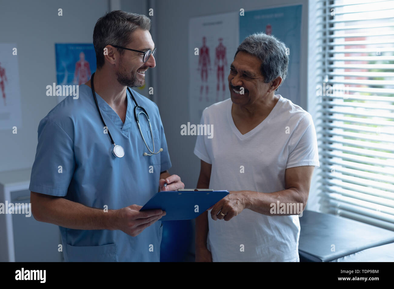 A skilled cardiothoracic surgeon in a hospital setting, interacting with a patient