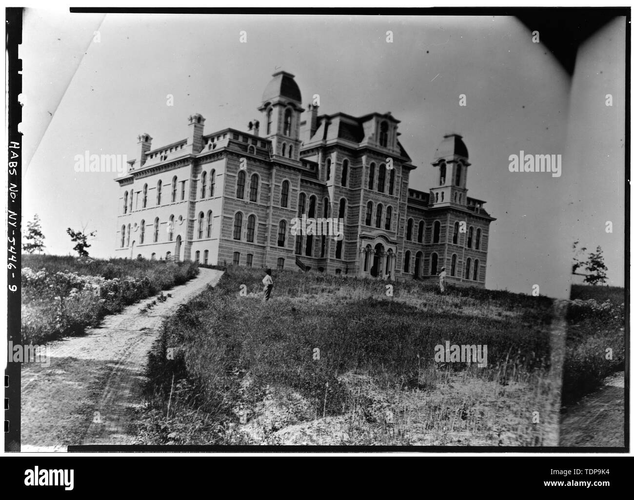 Photocopy of circa 1876 photograph (original stereo pair negative in the possession of Onondaga Historical Association) Mercer, Photographer NORTH FRONT AND EAST SIDE FROM EAST GATE - Syracuse University, Hall of Languages, Syracuse University Campus, Syracuse, Onondaga County, NY Stock Photo