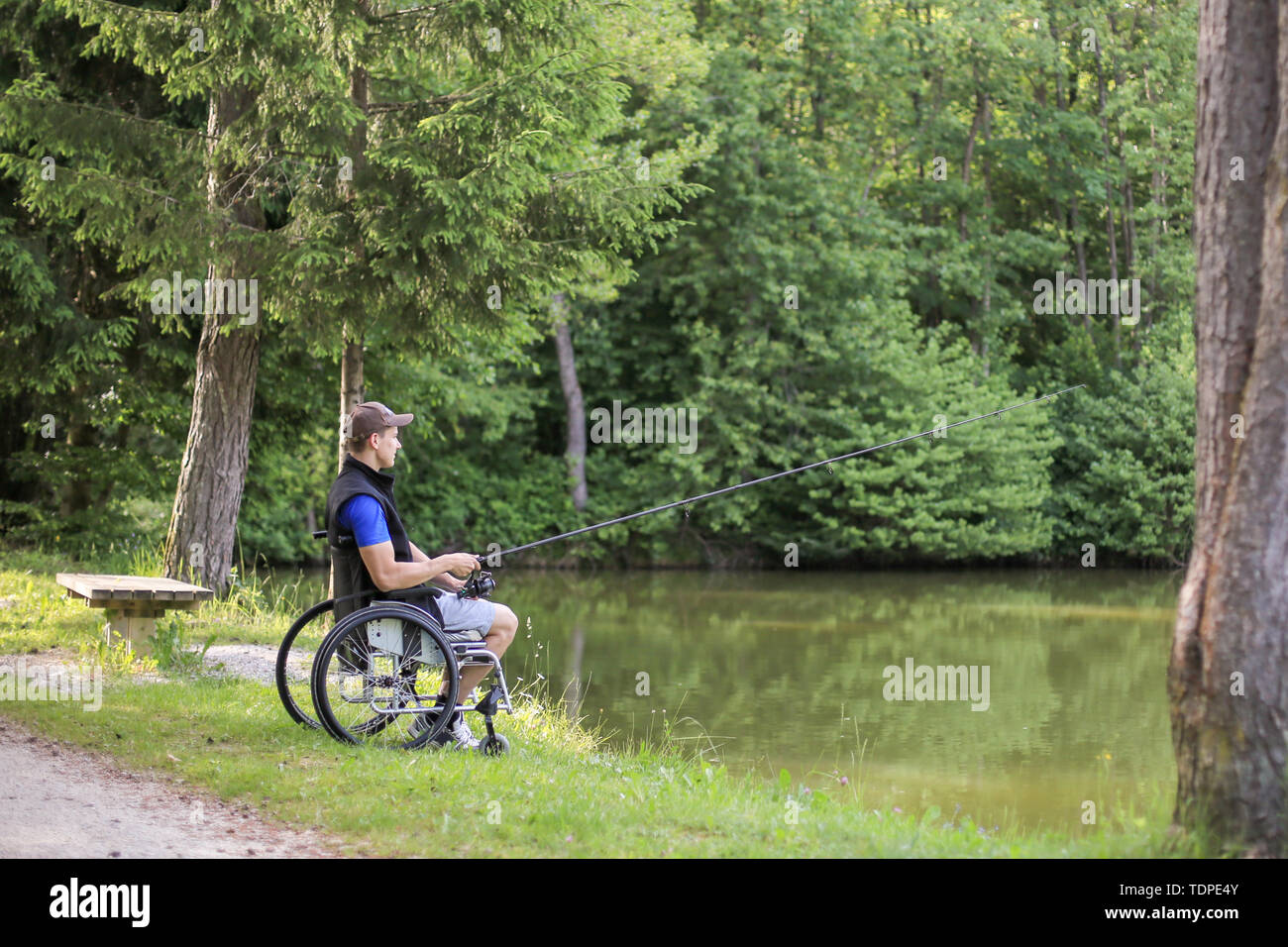 Fishing as an accessible competitive sport for people with disabilities and  also enjoying in nature for health benefits Stock Photo - Alamy