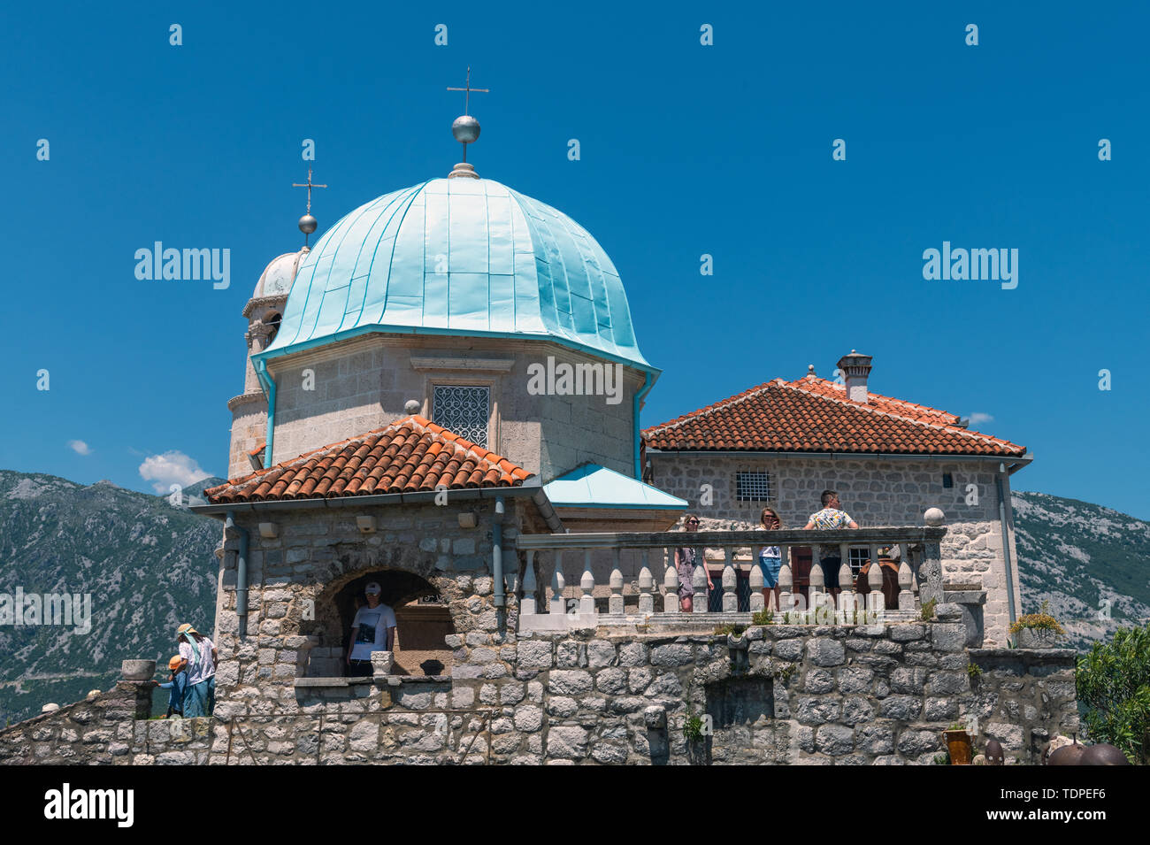 Perast, Montenegro - June 10. 2019: Church of Our Lady of Rocks on artificial island of Gospa od Skrpjela. Stock Photo