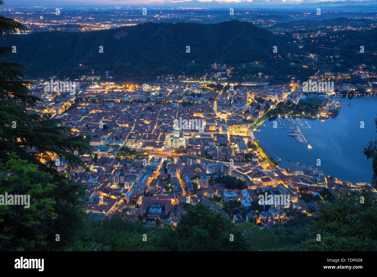 Como - The city with the Cathedral and lake Como at dusk. Stock Photo