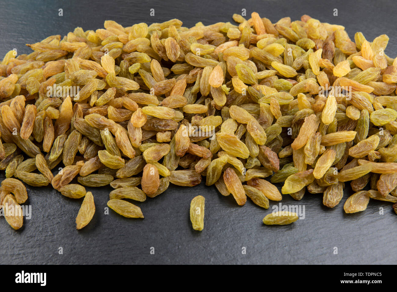 Background or texture of indian raisins. Close up Stock Photo Alamy