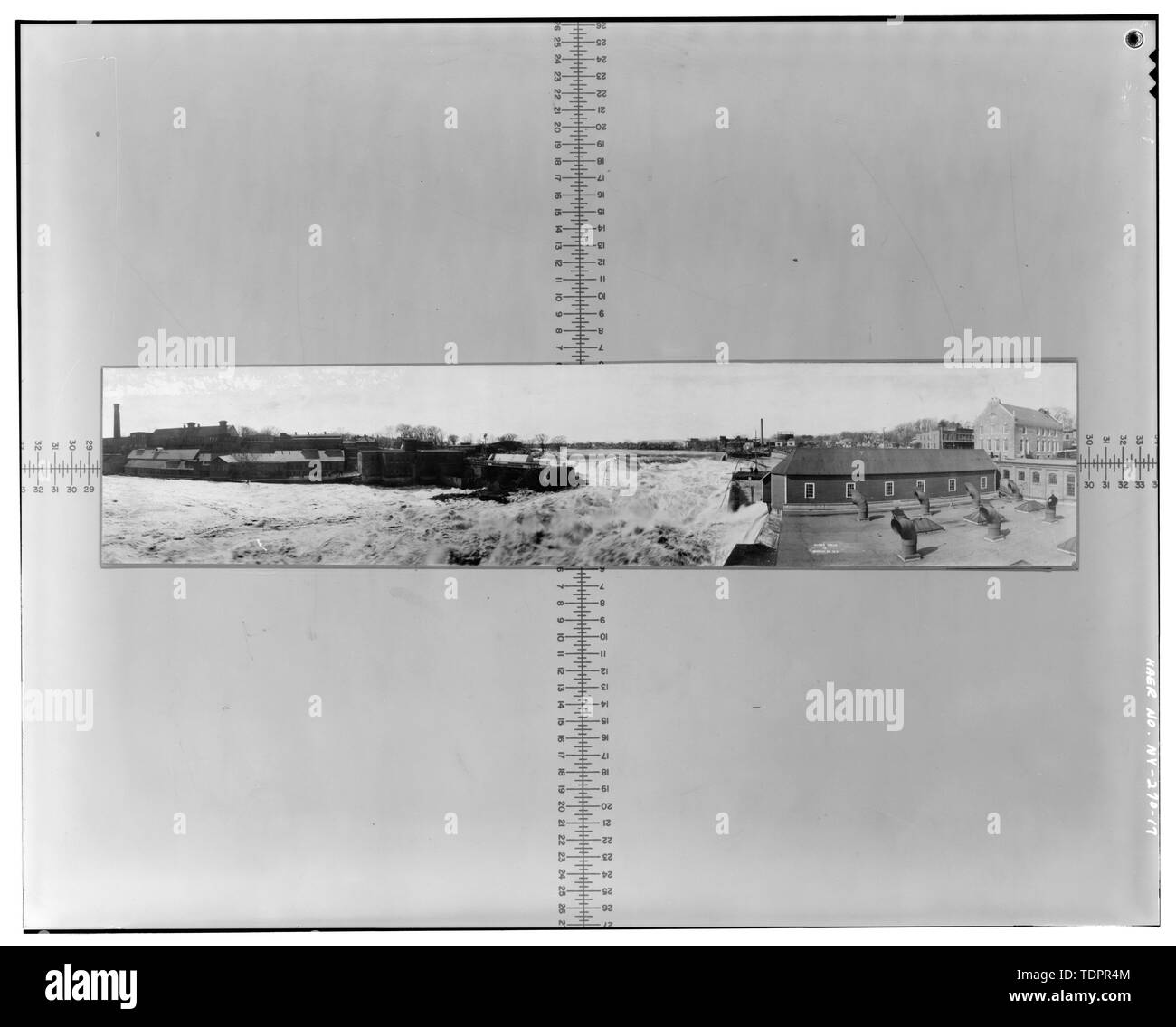 Photographic copy of photograph (at the offices of Finch, Pruyn and Company, Glen Street, Glens Falls, New York), Beach?, Photographer, March 28, 1913. Panoramic view of the Hudson River at Glens Falls during the March 1913 flood showing overtopped Glens Falls Dam and washed out bridge. Facing southwest. - Glens Falls Dam, 100' to 450' West of U.S. Route 9 Bridge Spanning Hudson River, Glens Falls, Warren County, NY Stock Photo