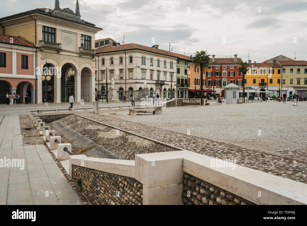Renaissance architecture and city life in a town square; Palmanova, Italy Stock Photo