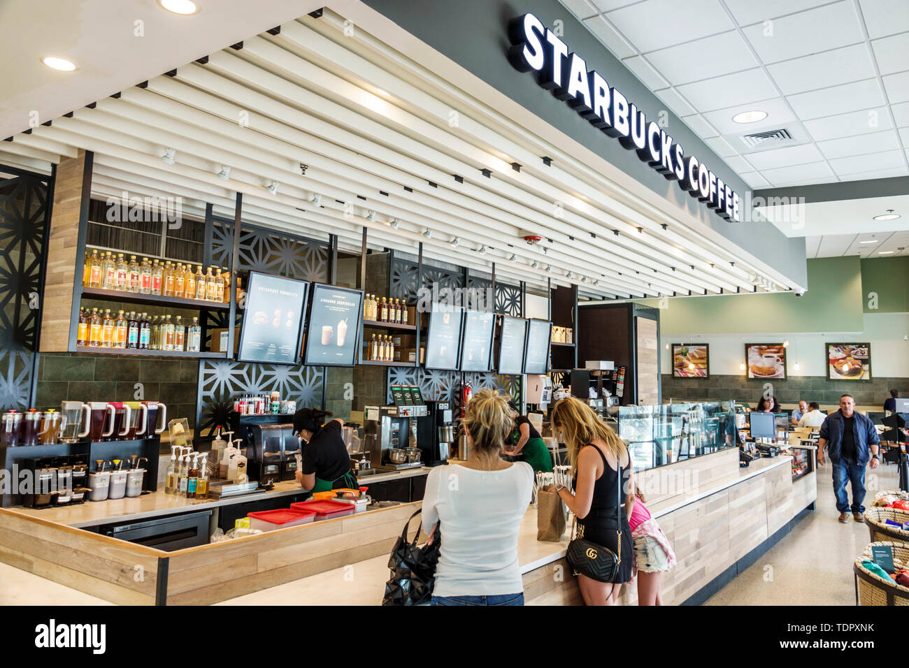 Miami Beach Florida,North Beach,Starbucks Coffee,coffeehouse,cafe,counter,woman female women,customer,FL190104081 Stock Photo