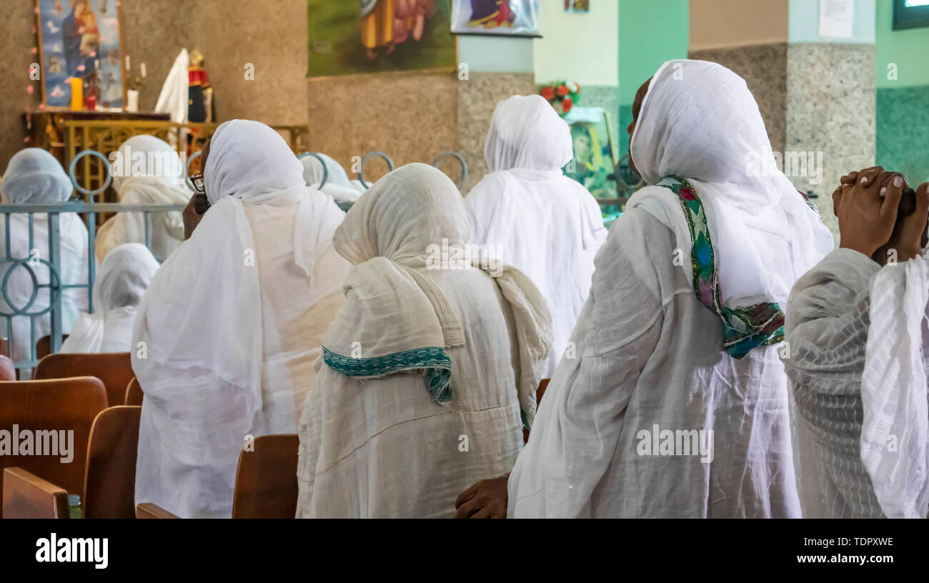 Eritrean women in white hijabs at the Enda Mariam Cathedral; Asmara, Central Region, Eritrea Stock Photo