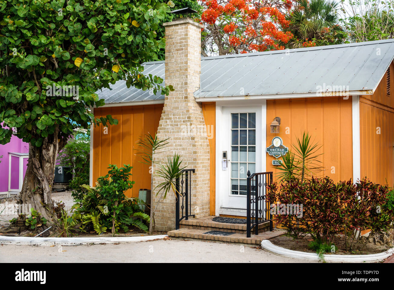 Captiva Island Florida,'Tween Waters Inn Island Resort & Spa,hotel,guest cottage,exterior,chimney,tropical foliage,FL190507018 Stock Photo