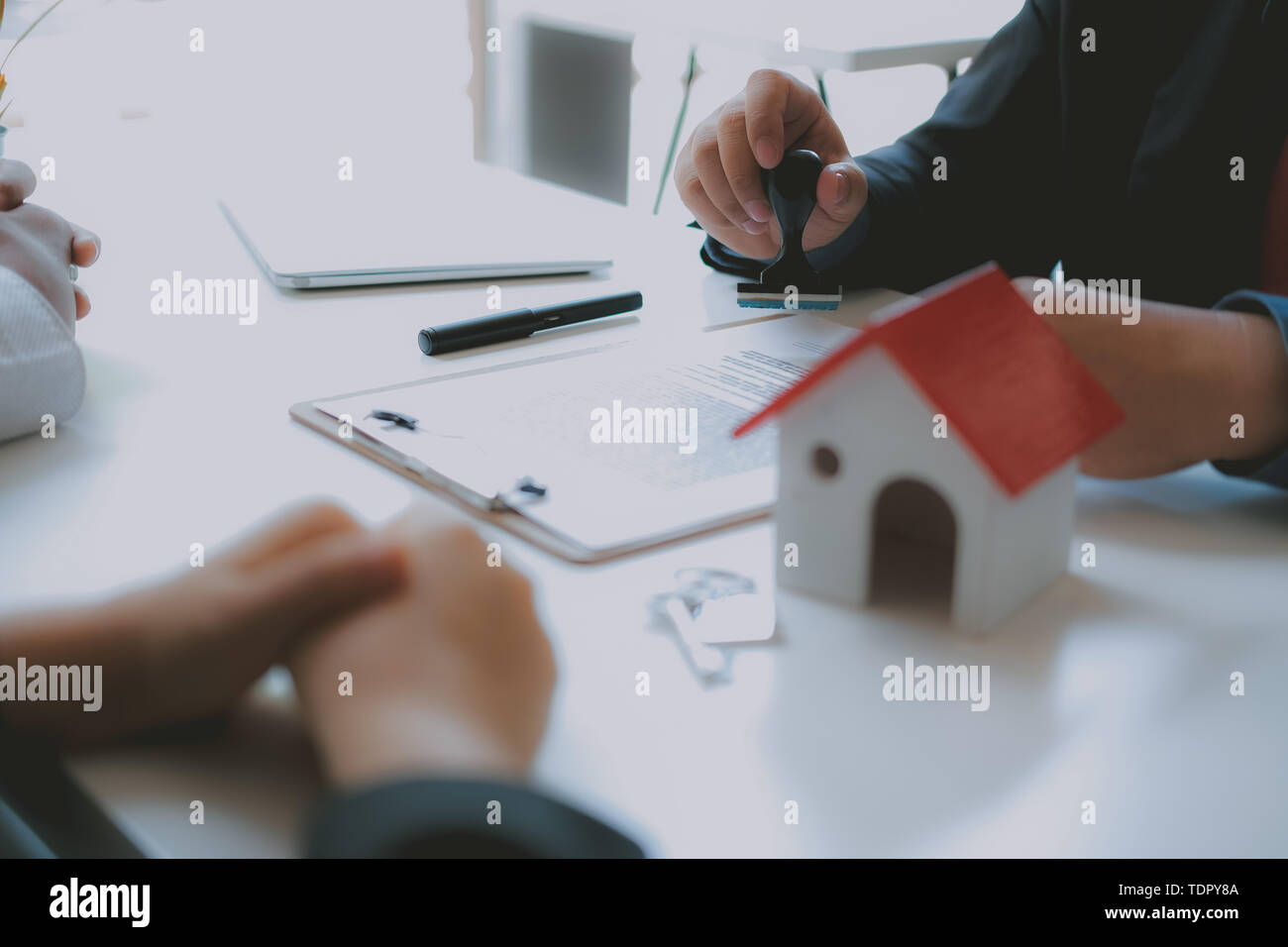 lawyer insurance broker consulting giving legal advice to couple