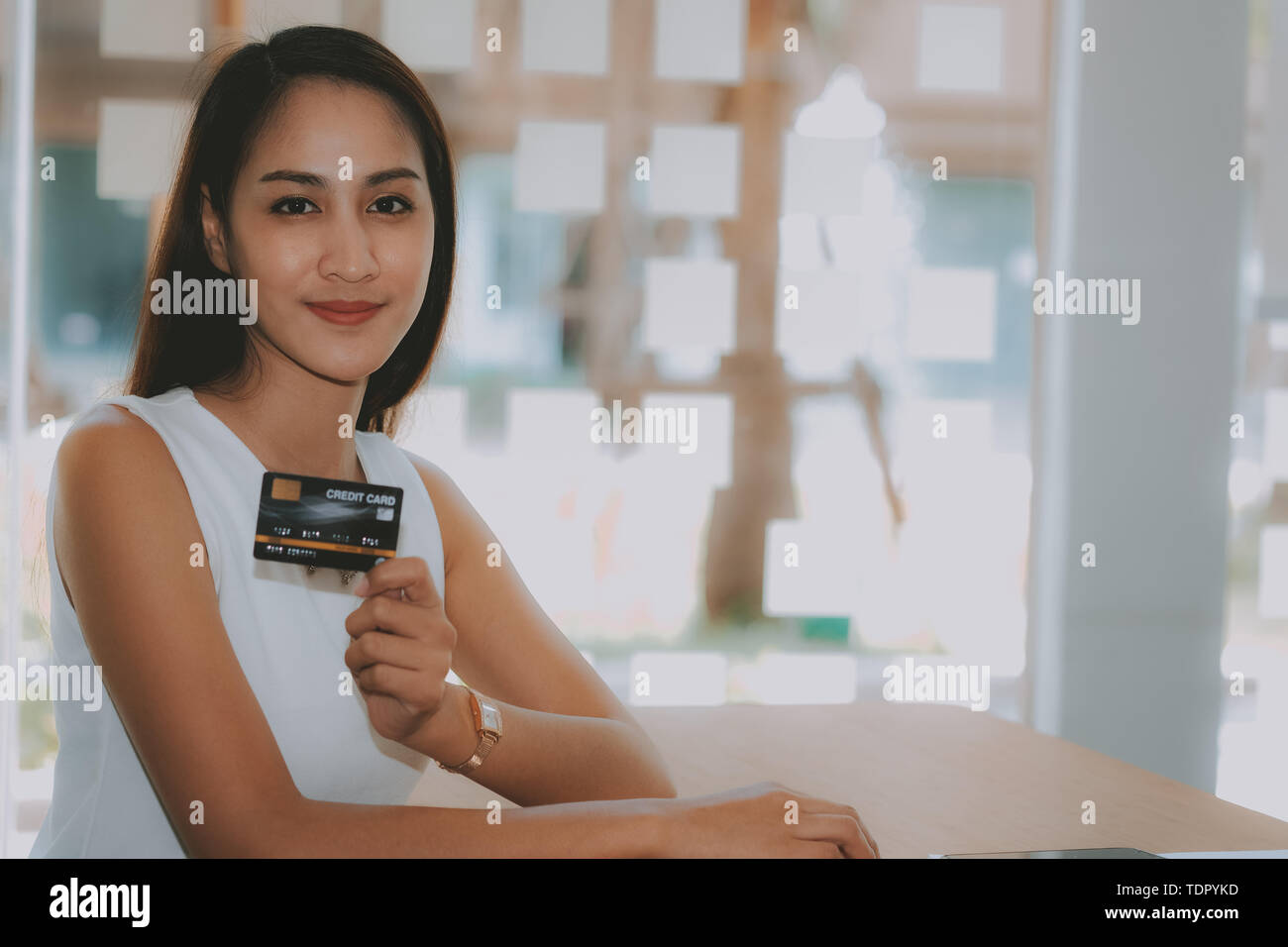 Smiling asian girl shopping hi-res stock photography and images - Alamy
