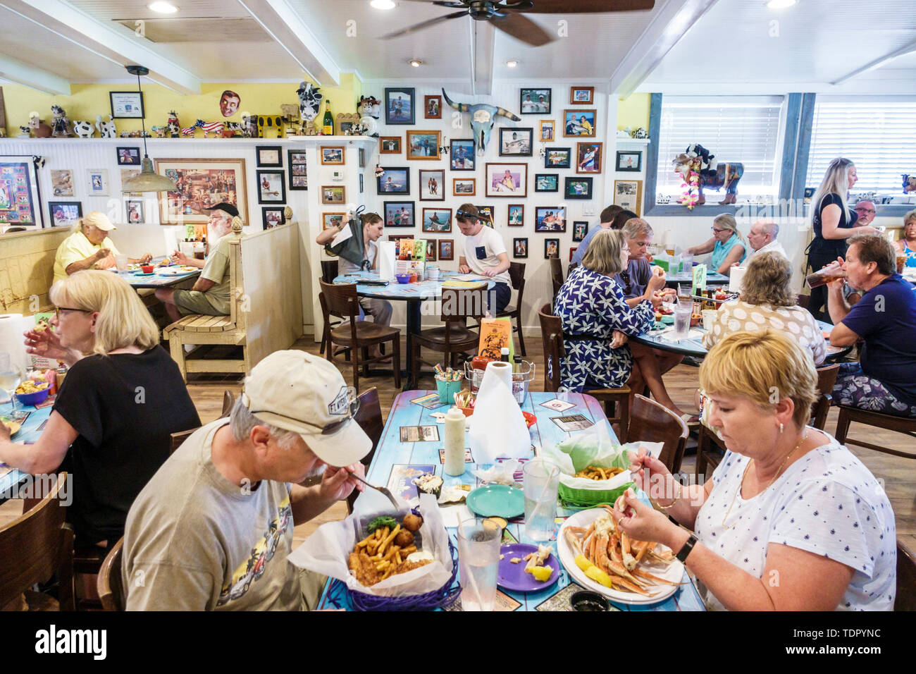 Sanibel Island Florida,The Island Cow,restaurant restaurants food dining cafe cafes,inside interior,dining,tables,customers,man men male,woman female Stock Photo