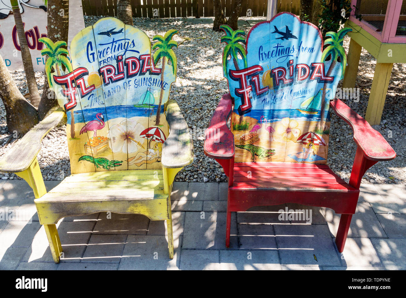 Sanibel Island Florida,The Island Cow,restaurant restaurants food dining cafe cafes,patio,outside exterior,painted Adirondack chairs,colorful,FL190509 Stock Photo