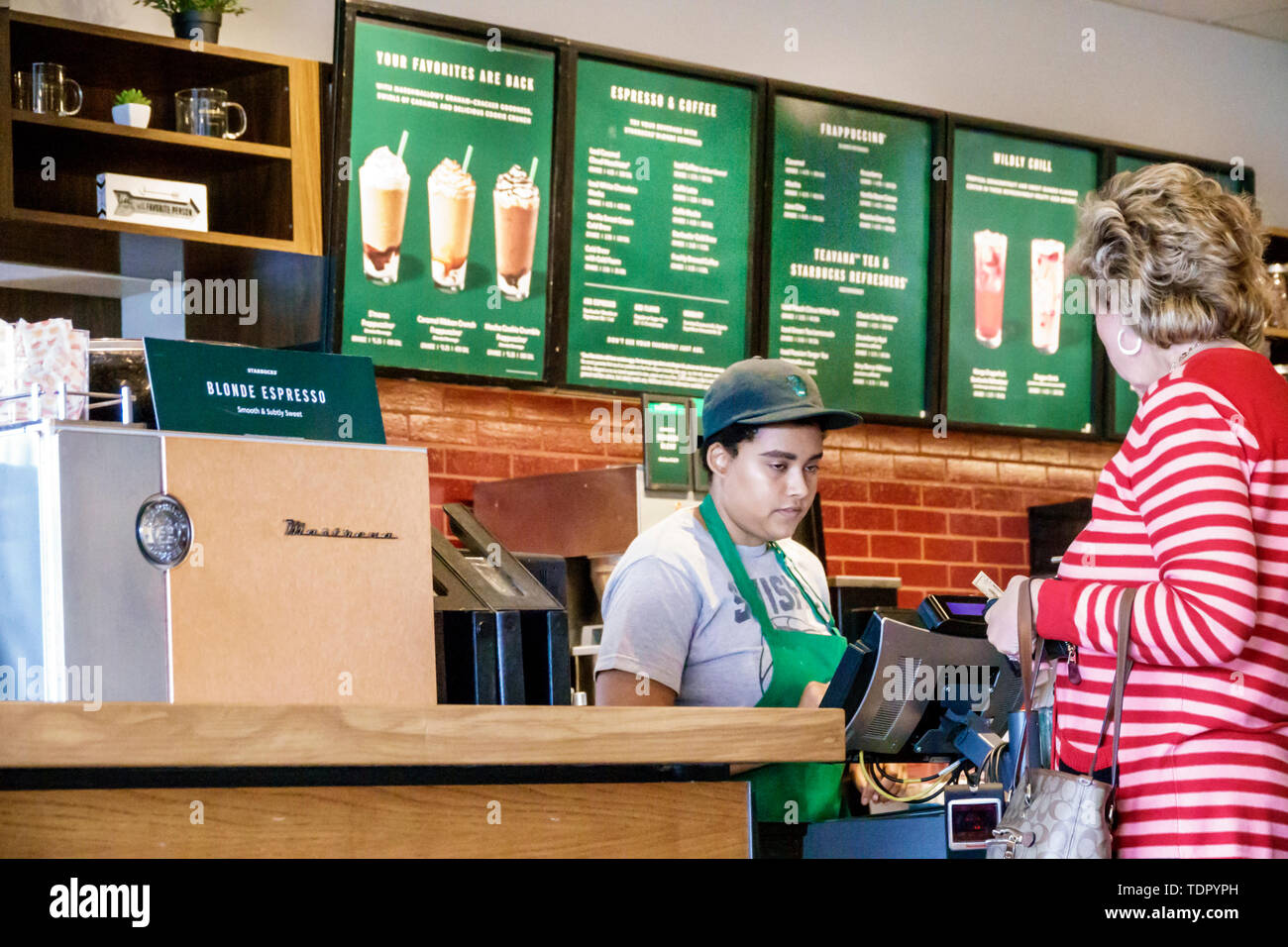 Fort Ft. Myers Florida,Starbucks Coffee,inside interior,barista,adult