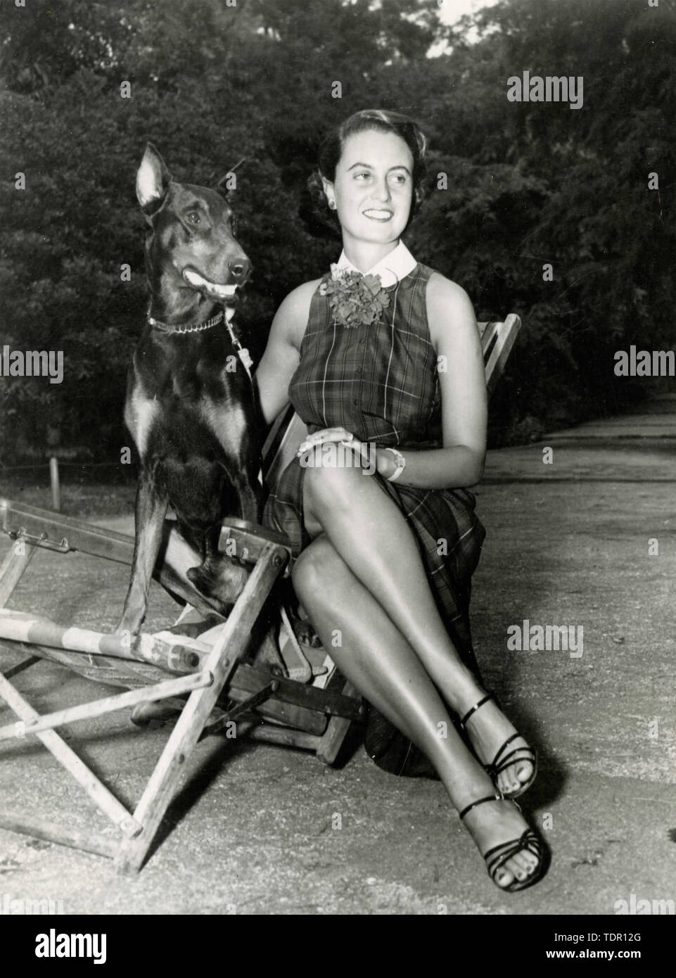 Unidentified woman with a Dobermann dog, 1960s Stock Photo