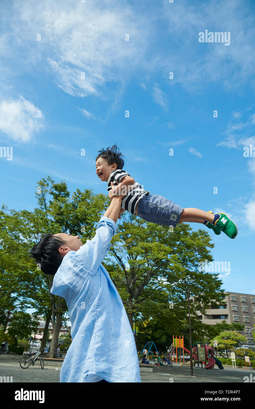 Japanese family in a city park Stock Photo Alamy