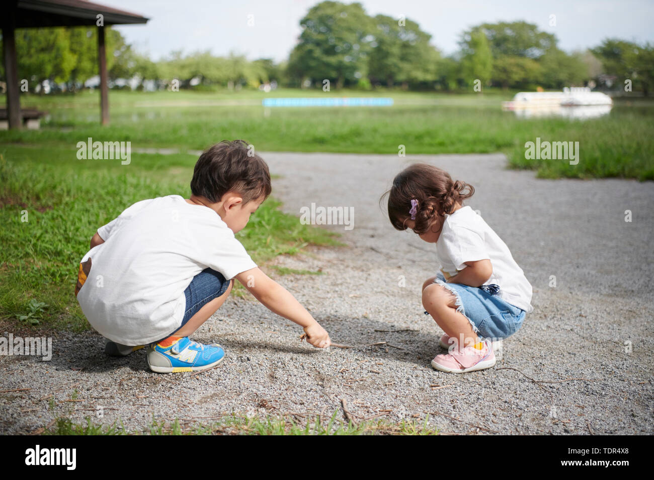 Japanese kids in a city park Stock Photo