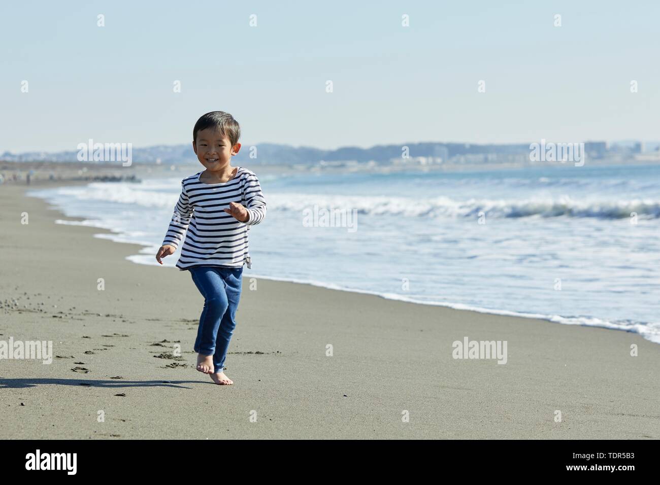 Japanese kid at the beach Stock Photo