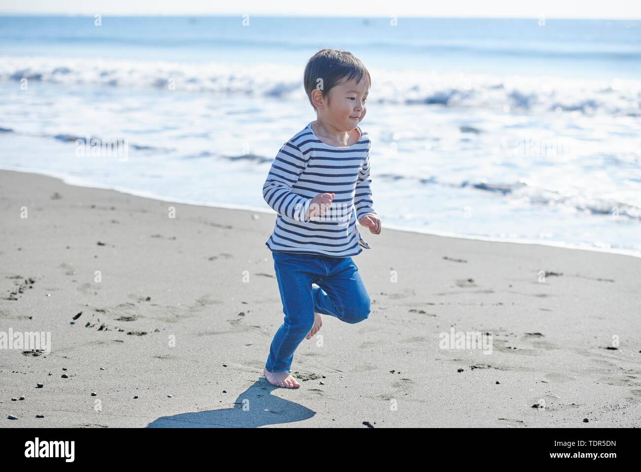 Japanese kid at the beach Stock Photo