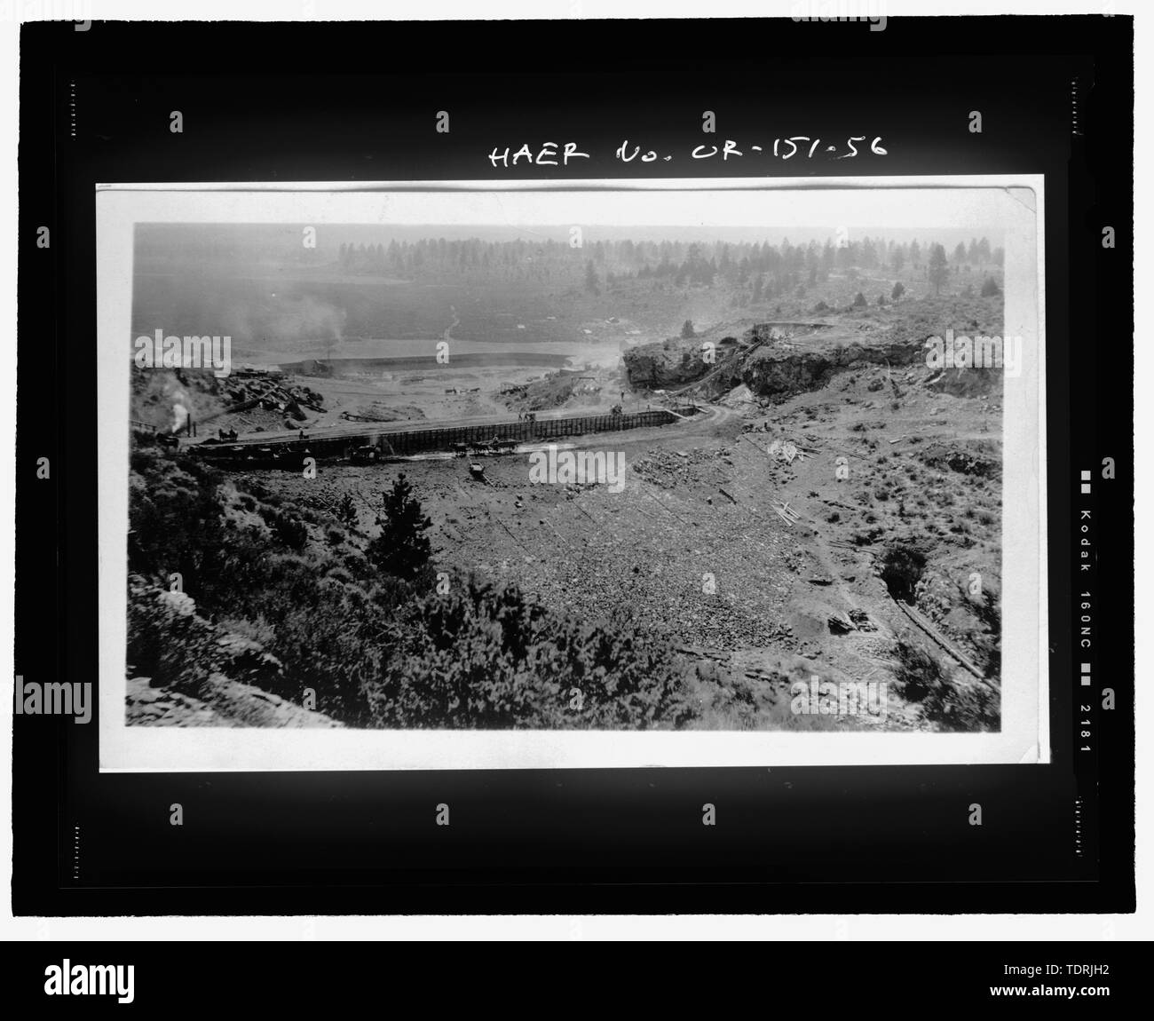 Photographic copy of TID photograph (from original print on file at TID office, Tumalo, Oregon). Photographer unknown, ca. 1913-1914 (Tumalo Dam construction, looking over dam to Tumalo Reservoir) - Tumalo Irrigation District, Tumalo Project, West of Deschutes River, Tumalo, Deschutes County, OR Stock Photo