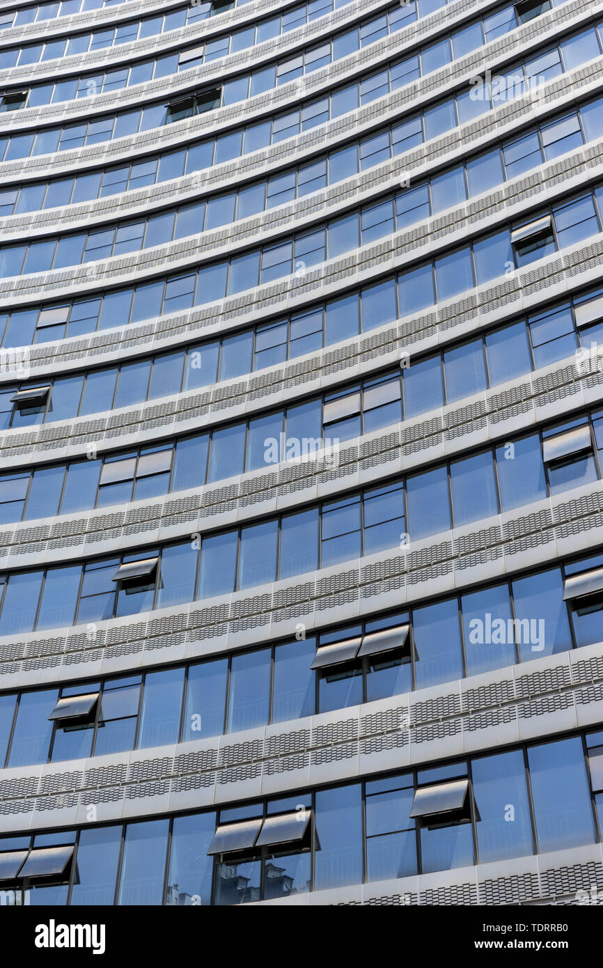 Modern office building with glass wall Stock Photo - Alamy