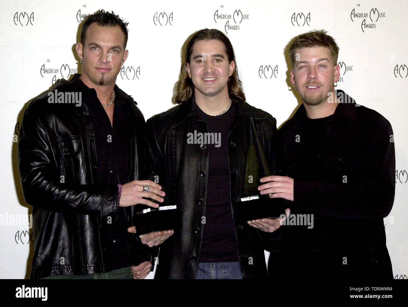 Jan 08, 2001; Los Angeles, CA, USA;  Members of the band Creed (L to R) MIKE TREMONTI, SCOTT STAPP, & SCOTT PHILLIPS @ the 2001 American Music Awards. (Credit Image: © Chris Delmas/ZUMA Wire) Stock Photo