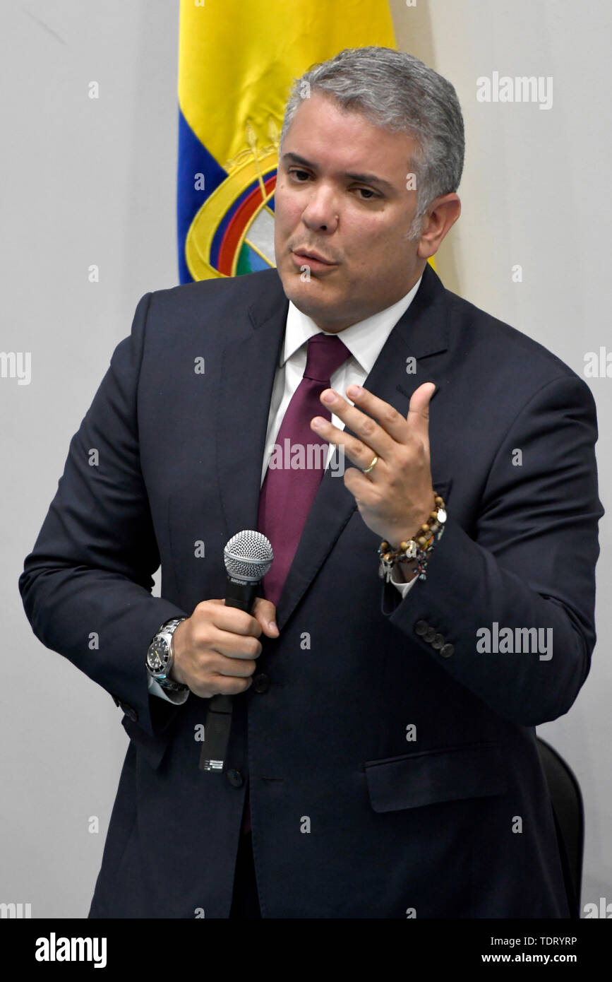 London, UK. 17th June, 2019. Colombian's President Ivan Duque is seen answering questions from the assistants to the event at Southbank University in London. Colombian community meet in South Bank University with Colombian President Ivan Duque as part of the official visit to London. Assistants to the meeting asked questions to the president about fracking, environmental issues, the peace process implementation, and questioning the risk that social leaders are in the country. Outside Southbank University demonstrators gathered to protest against Colombian president Ivan Duque's visit to London Stock Photo