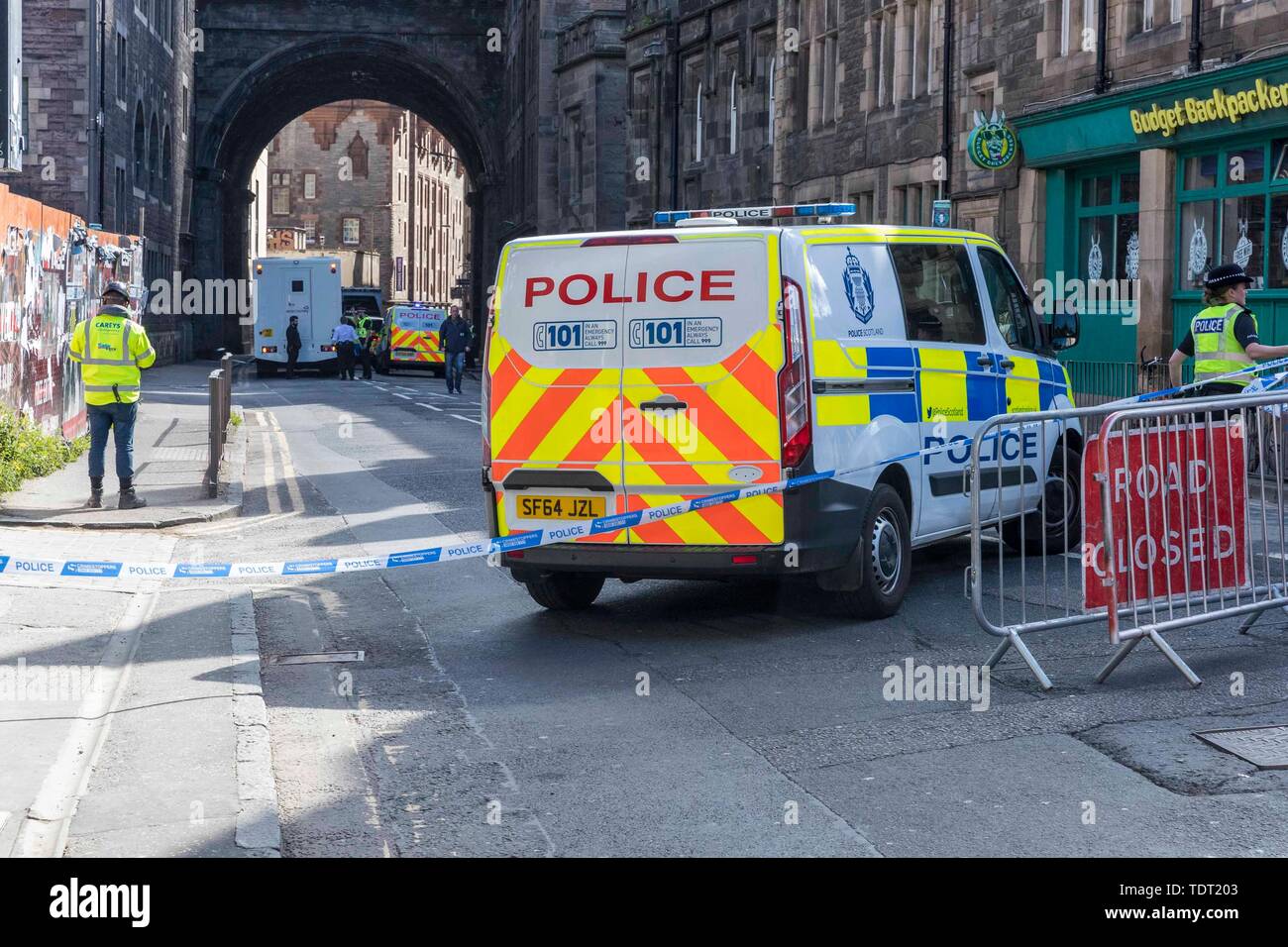 Edinburgh, Scotland, UK. 18th June, 2019. Edinburgh's Cowgate has been c loser falling reports of an individual falling from the George IV bridge. Police and ambulance are in attendance. Credit: Rich Dyson/Alamy Live News Stock Photo