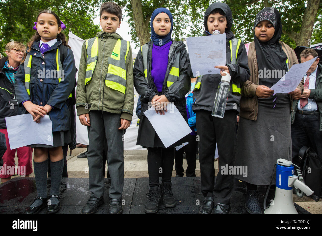 London, UK. 18 June, 2019. Children from the Hugh Myddelton Primary School Refugee Committee address a demonstration in Parliament Square to demand that the Government resettle 10,000 children over 10 years. As part of Lord Dubs’ ‘Our Turn’ campaign, councils around the UK have already pledged places for over 1,100 children if the Government should make a new resettlement commitment.  Credit: Mark Kerrison/Alamy Live News Stock Photo