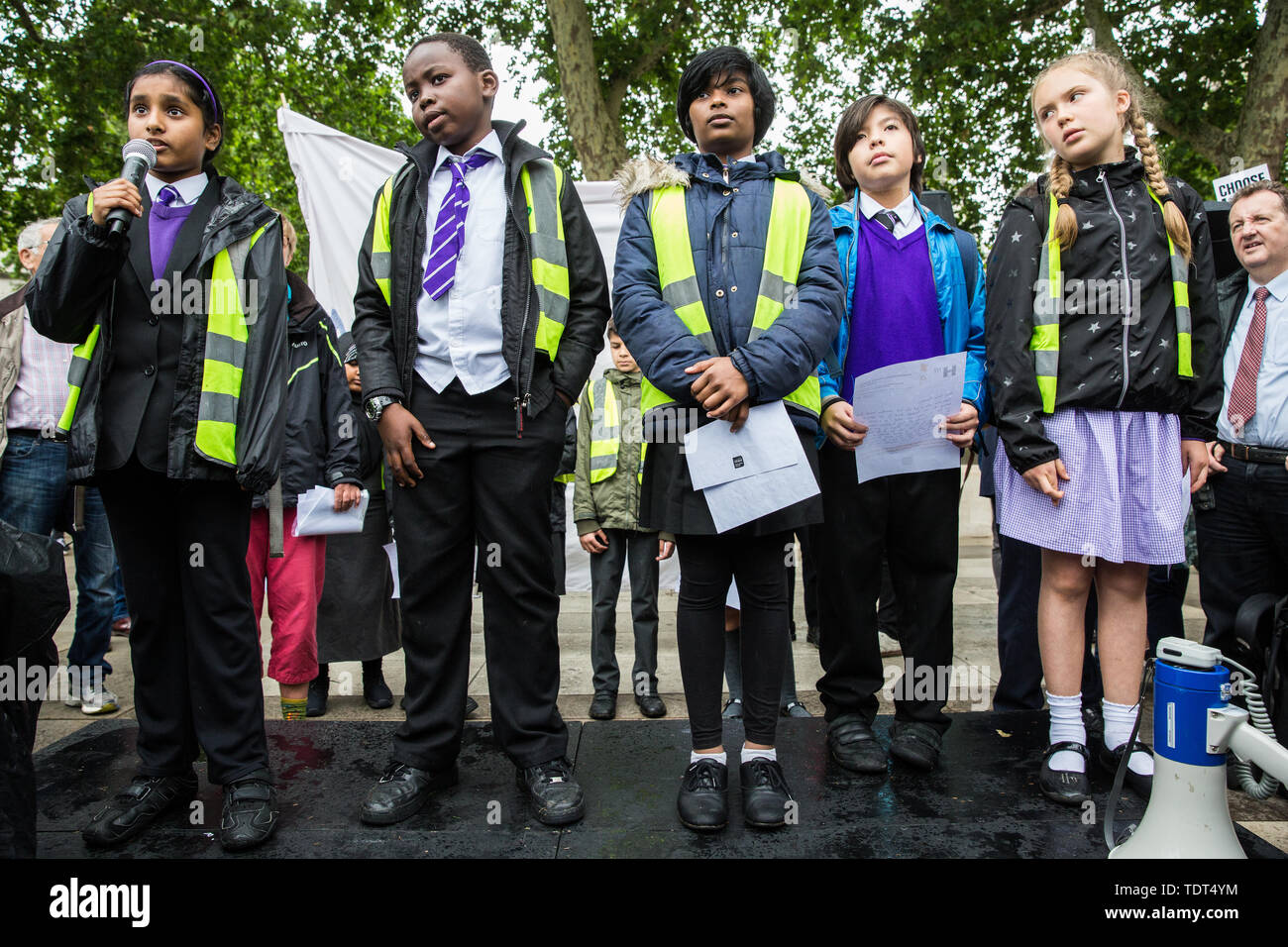 London, UK. 18 June, 2019. Children from the Hugh Myddelton Primary School Refugee Committee address a demonstration in Parliament Square to demand that the Government resettle 10,000 children over 10 years. As part of Lord Dubs’ ‘Our Turn’ campaign, councils around the UK have already pledged places for over 1,100 children if the Government should make a new resettlement commitment.  Credit: Mark Kerrison/Alamy Live News Stock Photo