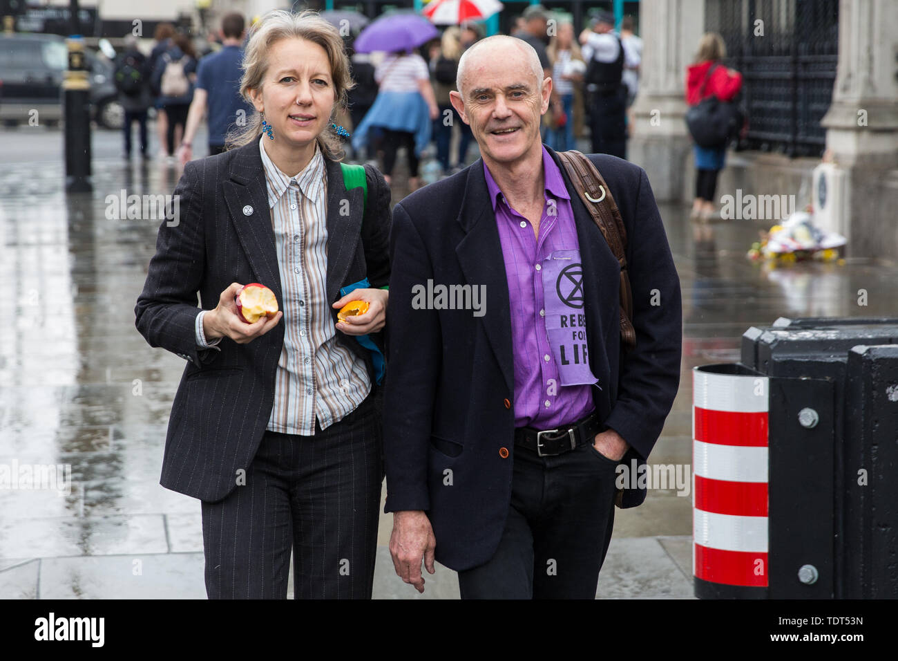 London, UK. 18 June, 2019. Dr Gail Bradbrook and Donnachadh McCarthy of Extinction Rebellion pass Parliament after giving evidence to MPs from the Business, Energy and Industrial Strategy Committee at Portcullis House together with representatives of the World Wildlife Fund (WWF) and the Environmental Defence Fund on clean growth strategy and International Climate Change targets. Credit: Mark Kerrison/Alamy Live News Stock Photo